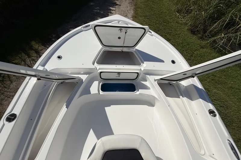 Slide: The Image of 2026 Tidewater 2210 Carolina Bay boat deck with open storage compartments. - 40
