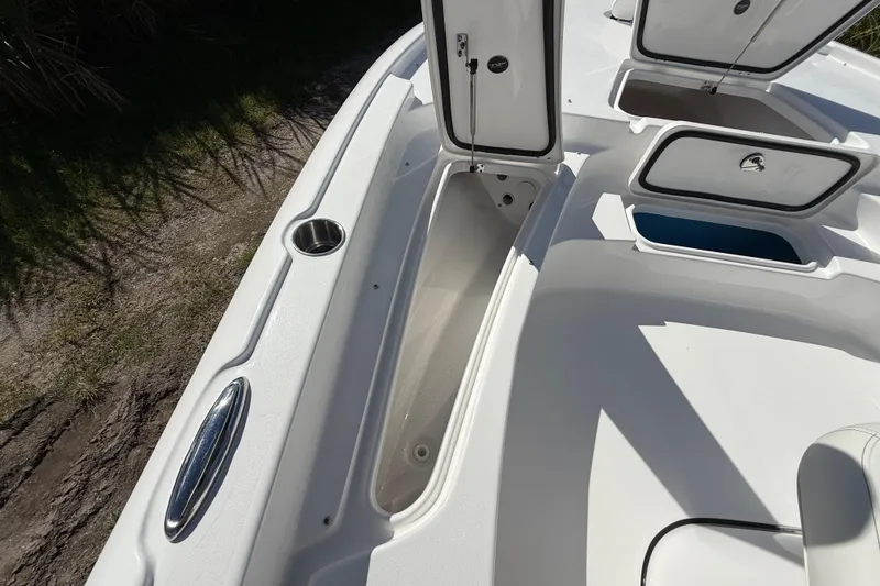 Slide: The Image of 2026 Tidewater 2210 Carolina Bay boat interior with open storage compartments. - 41