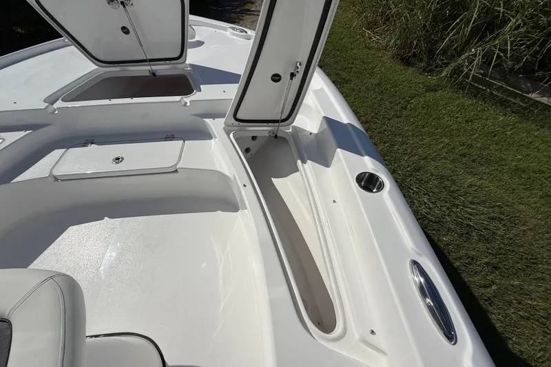 Slide: The Image of 2026 Tidewater 2210 Carolina Bay boat interior with open storage compartments. - 43