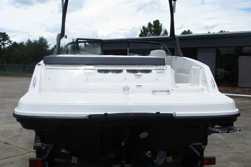 Slide: The Image of 2022 Bayliner VR5 Bowrider I/O, rear view, parked outdoors on concrete. - 2