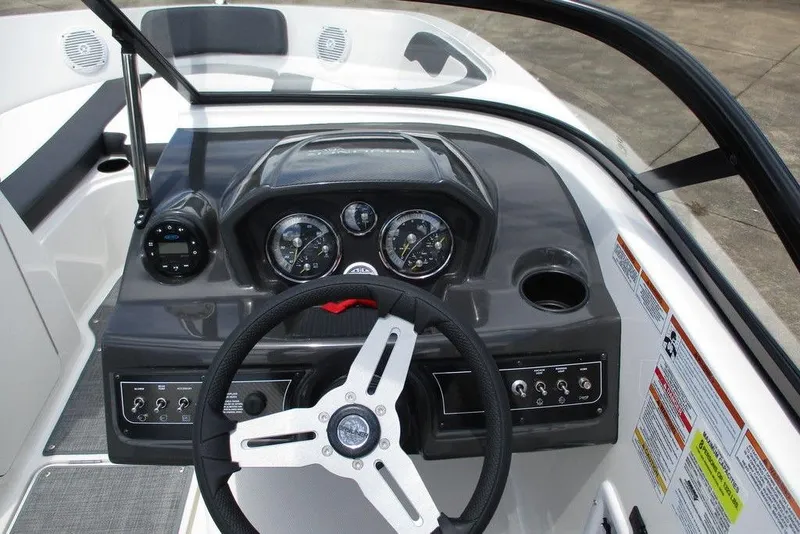 Slide: The Image of 2022 Bayliner VR5 Bowrider I/O dashboard with steering wheel and instrument panel. - 4