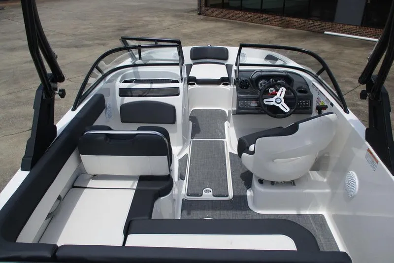 Slide: The Image of 2022 Bayliner VR5 Bowrider I/O interior with seating and steering console. - 5