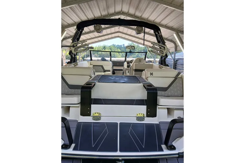 Slide: The Image of 2023 Heyday H22 boat interior under a metal canopy, showcasing seating and design. - 12