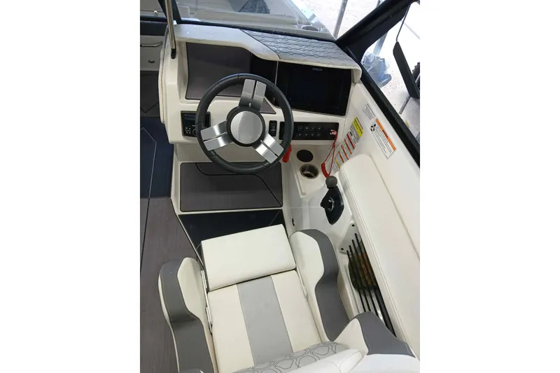 Slide: The Image of 2023 Heyday H22 boat interior with steering wheel and control panel. - 8