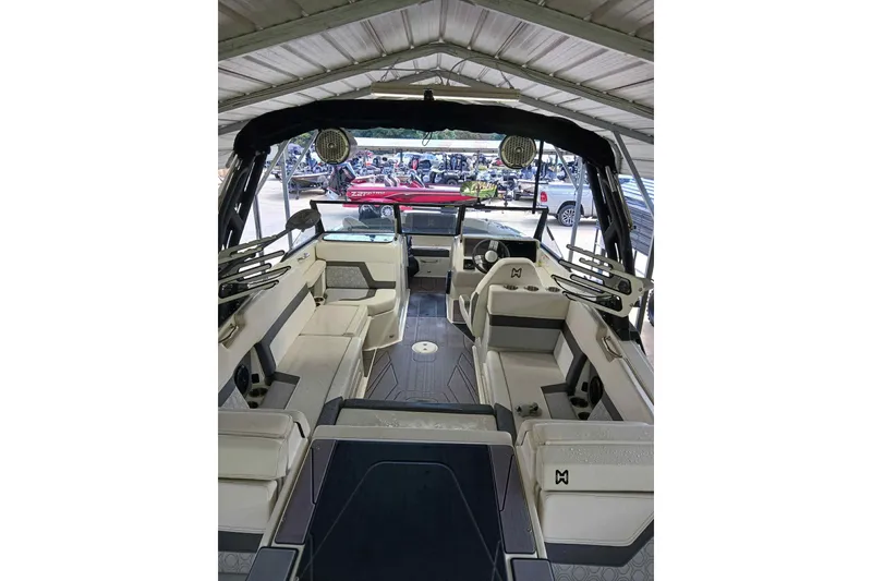 Slide: The Image of 2023 Heyday H22 boat interior with spacious seating and modern design under a canopy. - 7