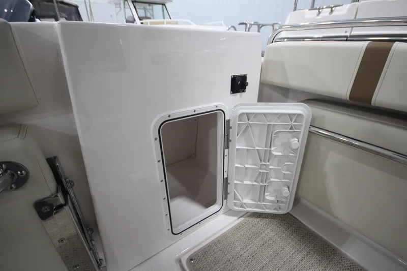 Slide: The Image of Open storage compartment on 2026 Ranger Tugs R-25 boat, showcasing interior space. - 17