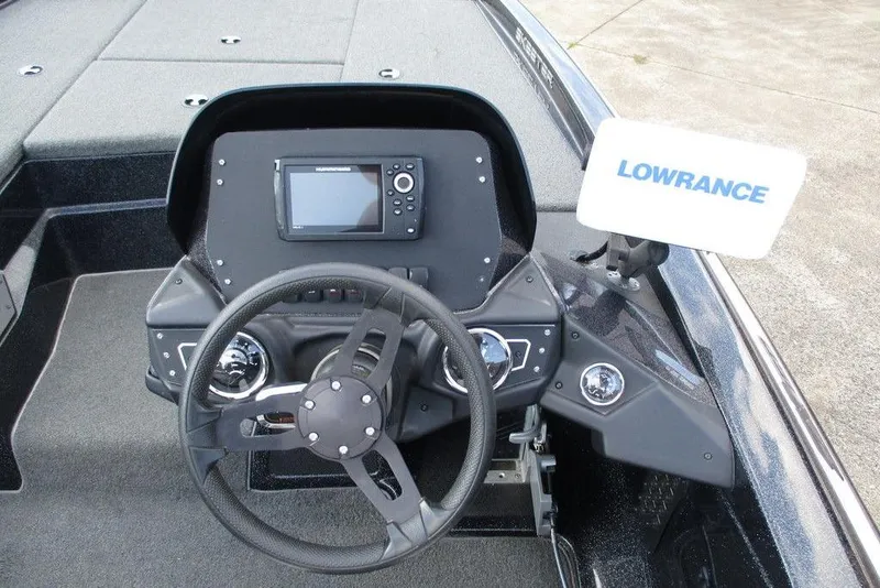 Slide: The Image of 2020 Skeeter ZX150 boat dashboard with Lowrance navigation system and steering wheel. - 7