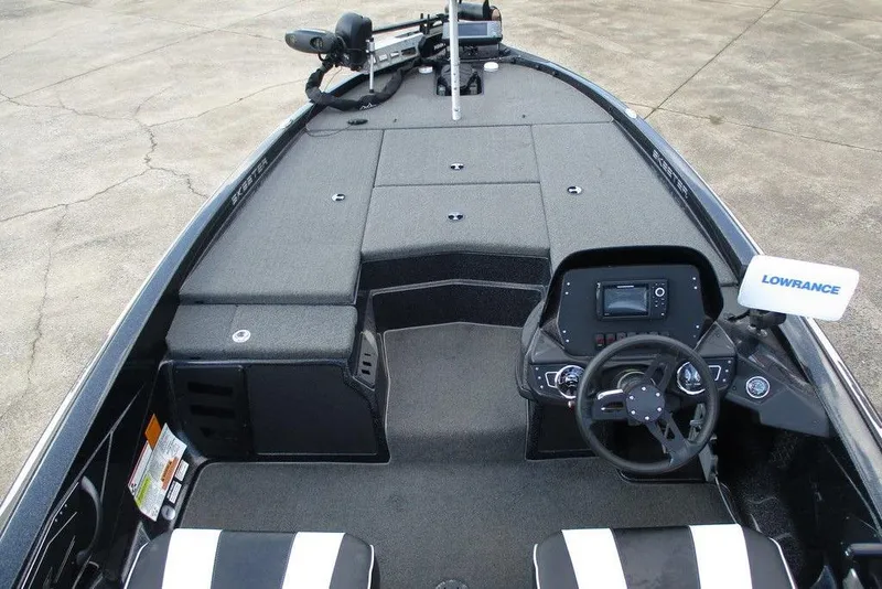Slide: The Image of 2020 Skeeter ZX150 boat interior with Lowrance electronics and steering console. - 8