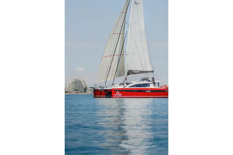 Slide: The Image of Red Privilege Signature 510 yacht sailing on calm waters, 2025 model. - 75