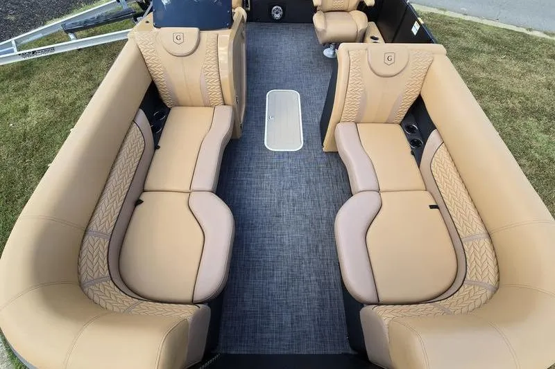 Slide: The Image of Luxurious interior of 2025 Godfrey Monaco 235 DFL pontoon boat with tan seating and modern design. - 17