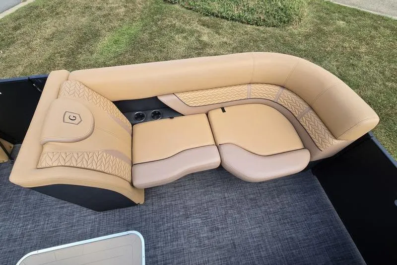 Slide: The Image of Luxurious seating on 2025 Godfrey Monaco 235 DFL iMPACT pontoon boat, featuring tan upholstery. - 18