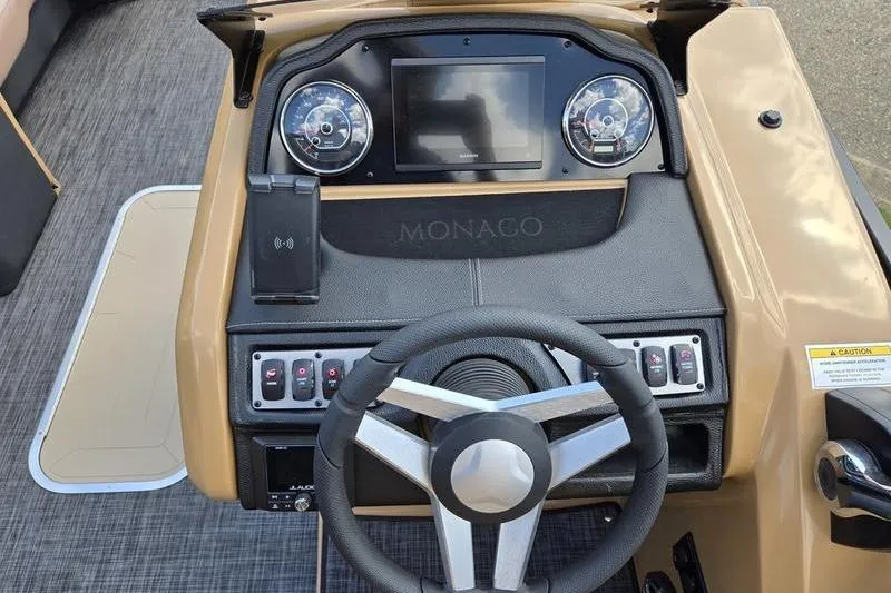 Slide: The Image of 2025 Godfrey Monaco 235 DFL iMPACT boat dashboard with steering wheel and controls. - 4