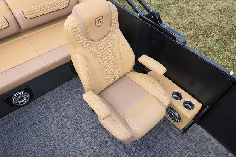 Slide: The Image of Luxurious seating in 2025 Godfrey Monaco 235 DFL iMPACT pontoon boat, featuring tan upholstery. - 9