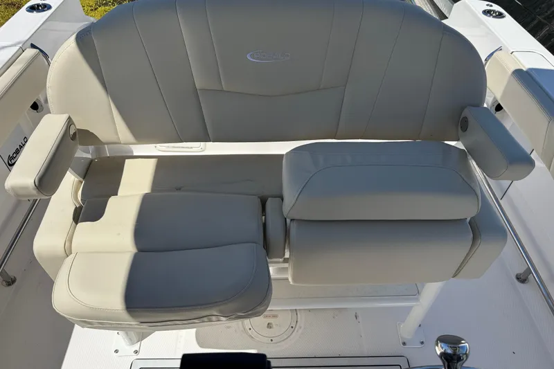 Slide: The Image of Robalo R232 Explorer 2026 boat seat with armrests, featuring light gray upholstery. - 21