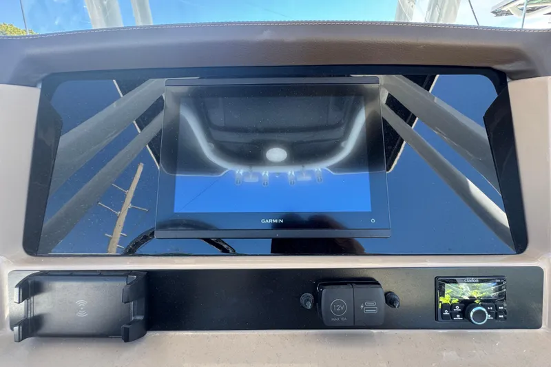Slide: The Image of Dashboard of 2026 Robalo R232 Explorer with Garmin display and Clarion audio system. - 25