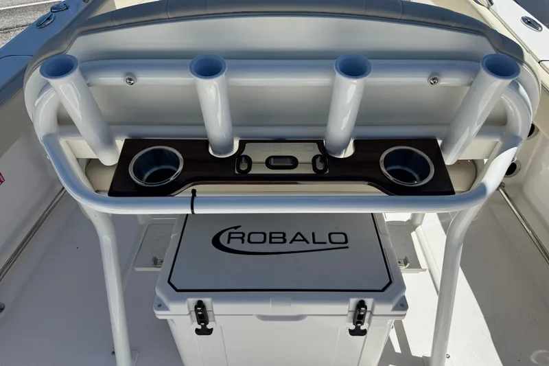 Slide: The Image of 2026 Robalo R232 Explorer boat with rod holders and cooler. - 6