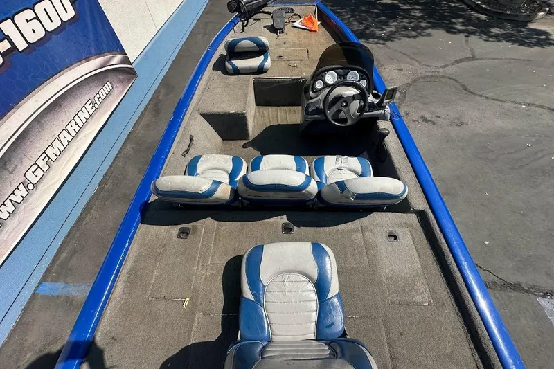 Slide: The Image of 2005 Bass Tracker Pro Team 175 boat interior with blue and gray seating. - 12