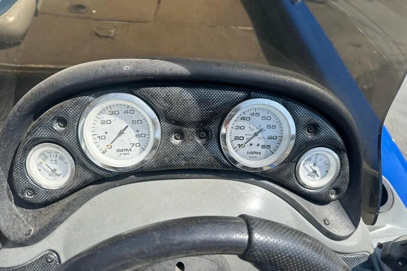Slide: The Image of Dashboard of a 2005 Bass Tracker Pro Team 175 boat with gauges for RPM, speed, and fuel. - 15