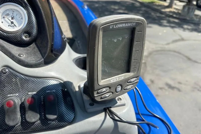 Slide: The Image of 2005 Bass Tracker Pro Team 175 dashboard with Lowrance X37 TX fish finder. - 16