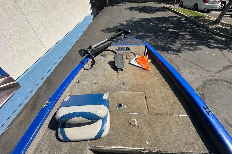 Slide: The Image of 2005 Bass Tracker Pro Team 175 boat interior with blue accents and fishing equipment. - 18