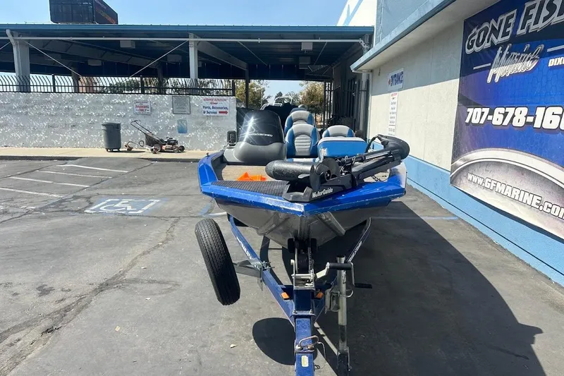 Slide: The Image of 2005 Bass Tracker Pro Team 175 boat on trailer in parking lot. - 3