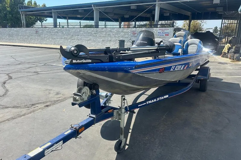 Slide: The Image of 2005 Bass Tracker Pro Team 175 boat on trailer in parking lot. - 4