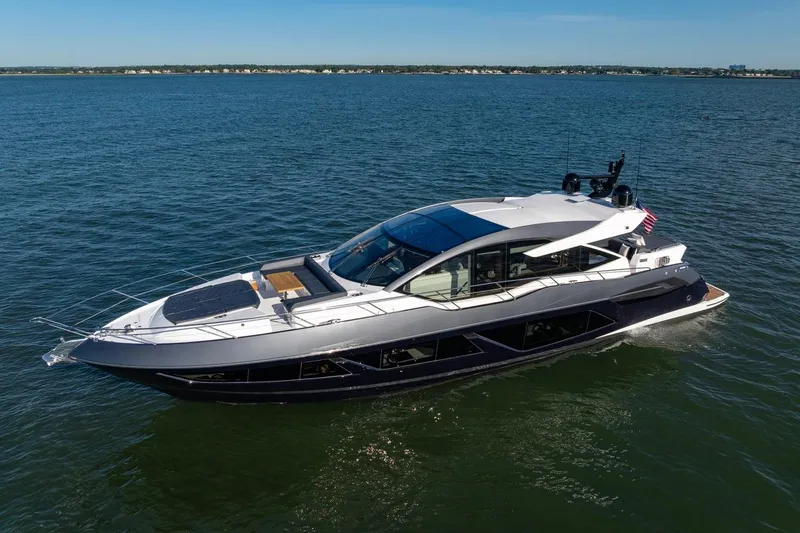 Slide: The Image of 2020 Sunseeker Predator 74 yacht cruising on open water. - 2