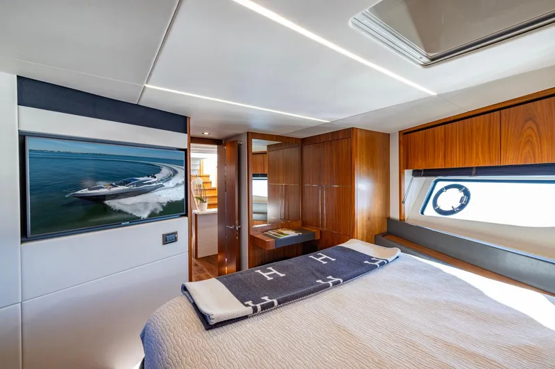 Slide: The Image of Luxurious interior of 2020 Sunseeker Predator 74 yacht with elegant wood finishes. - 33