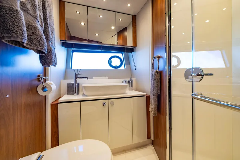 Slide: The Image of Luxurious bathroom on 2020 Sunseeker Predator 74 yacht with modern fixtures and elegant design. - 34