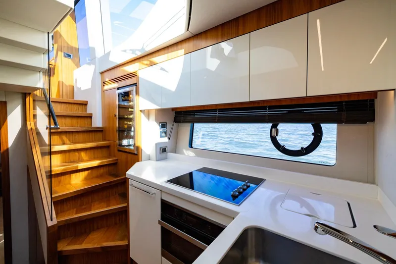 Slide: The Image of Luxurious interior of 2020 Sunseeker Predator 74 yacht with modern kitchen and wooden stairs. - 49