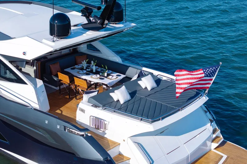 Slide: The Image of Luxurious 2020 Sunseeker Predator 74 yacht with elegant deck and American flag. - 5