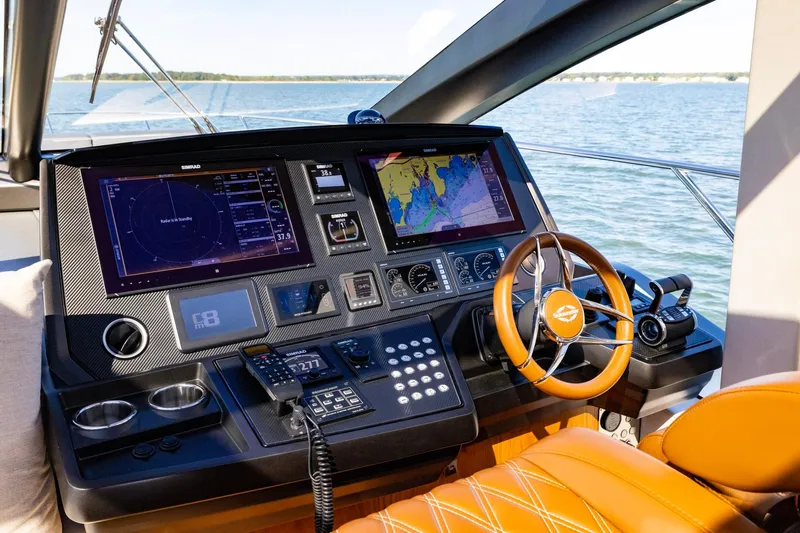 Slide: The Image of Cockpit of 2020 Sunseeker Predator 74 yacht with advanced navigation systems and leather steering wheel. - 55