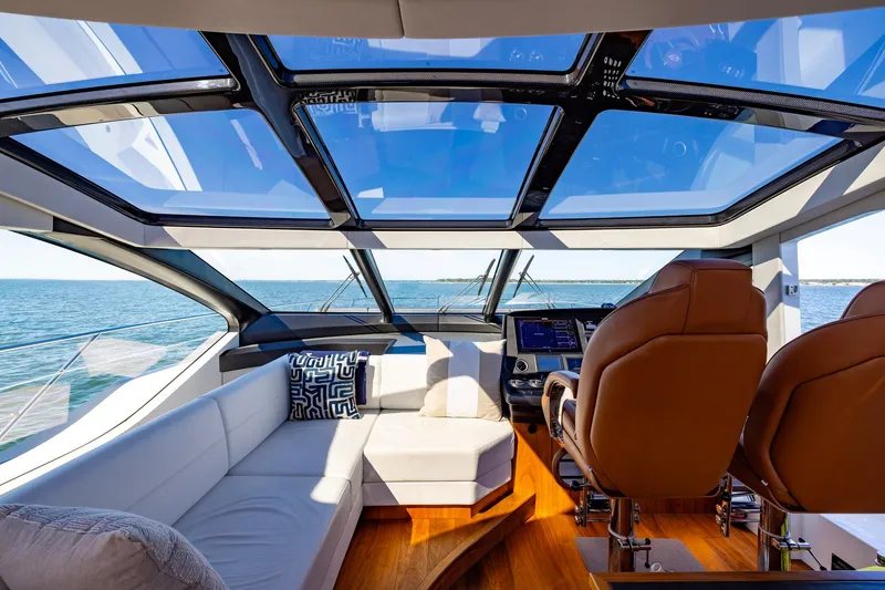 Slide: The Image of Luxurious interior of 2020 Sunseeker Predator 74 yacht with panoramic windows and plush seating. - 60