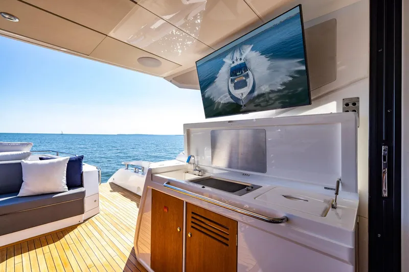 Slide: The Image of Luxurious Sunseeker Predator 74 yacht interior with ocean view, featuring modern amenities, 2020 model. - 61