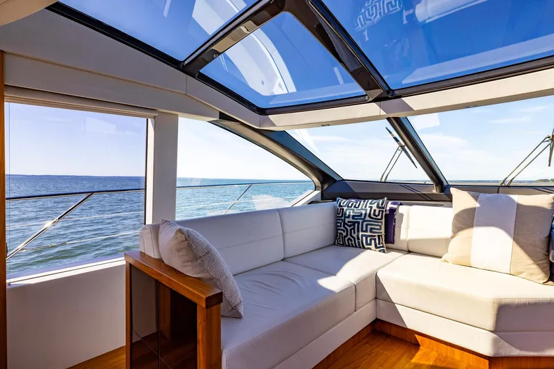Slide: The Image of Luxurious interior of 2020 Sunseeker Predator 74 yacht with ocean view and plush seating. - 62