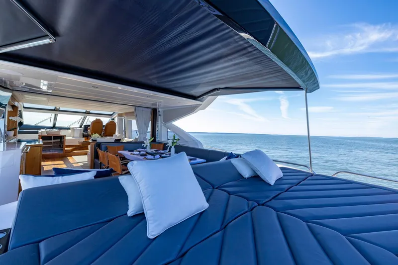 Slide: The Image of Luxurious 2020 Sunseeker Predator 74 yacht interior with ocean view and elegant seating. - 68