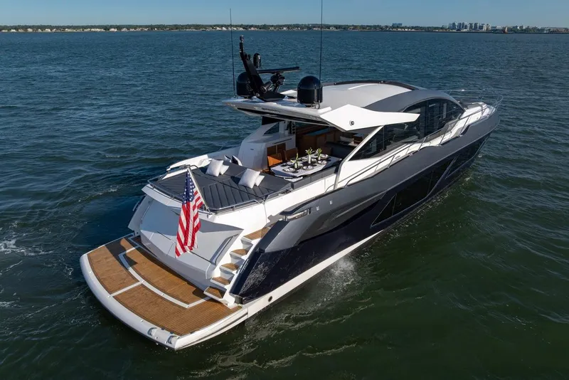Slide: The Image of 2020 Sunseeker Predator 74 yacht cruising on open water, rear view. - 7