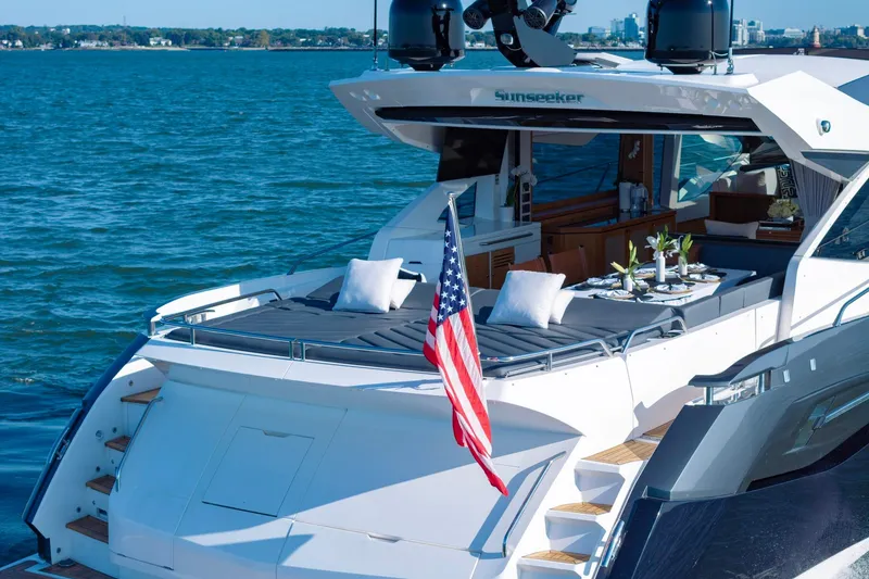 Slide: The Image of Luxury Sunseeker Predator 74 yacht, 2020 model, with elegant deck and American flag. - 8