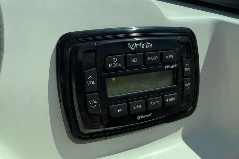 Slide: The Image of Infinity stereo system on 2018 NauticStar 223 DC boat dashboard. - 17
