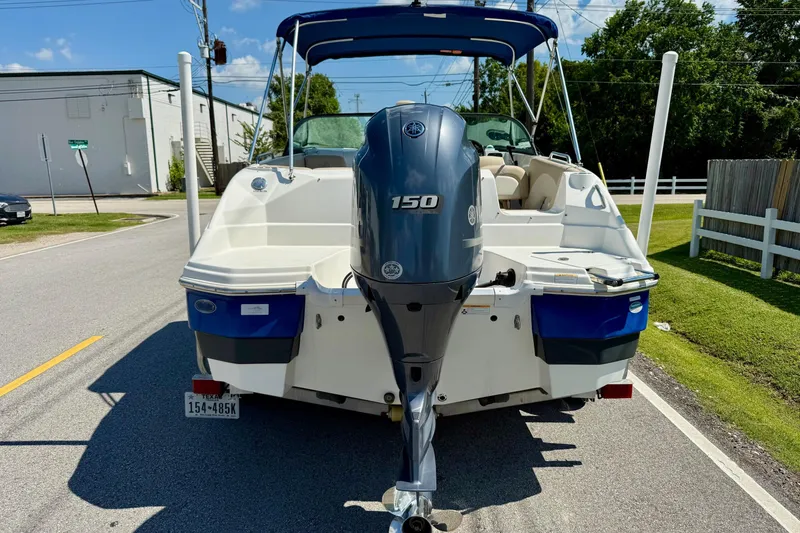 Slide: The Image of 2018 NauticStar 223 DC boat with Yamaha 150 engine on a sunny street. - 3