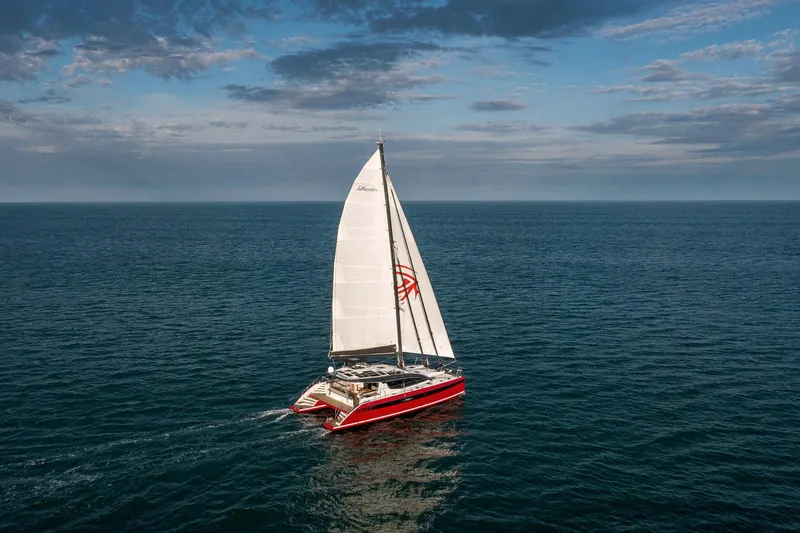 Slide: The Image of Red Privilege Signature 510 yacht from 2025 on calm water. - 3