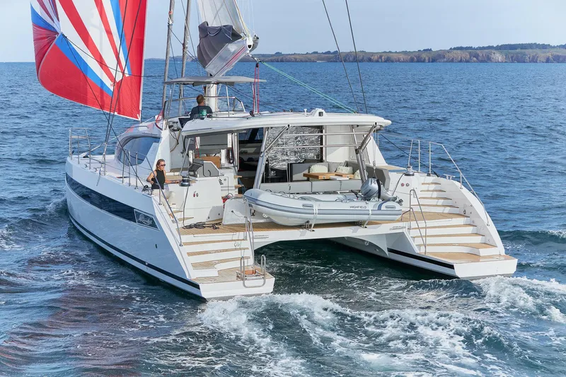 Slide: The Image of Red Privilege Signature 510 catamaran on water, year 2025. - 5