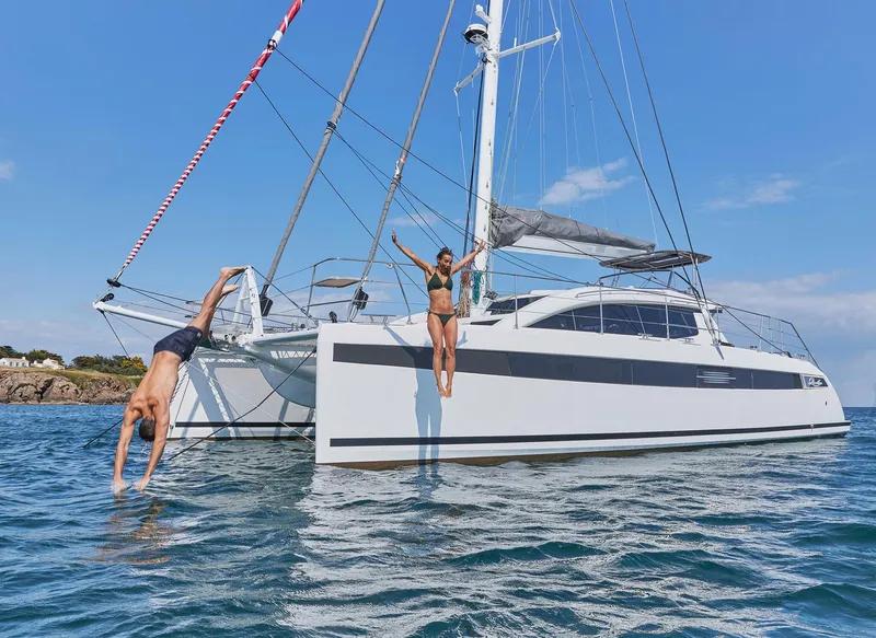 Slide: The Image of Red Privilege Signature 510 catamaran bow, year 2025. - 7