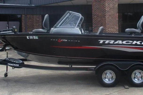 The Image of 2018 Tracker Pro Guide V-175 Combo boat on trailer, black with red accents. - 1
