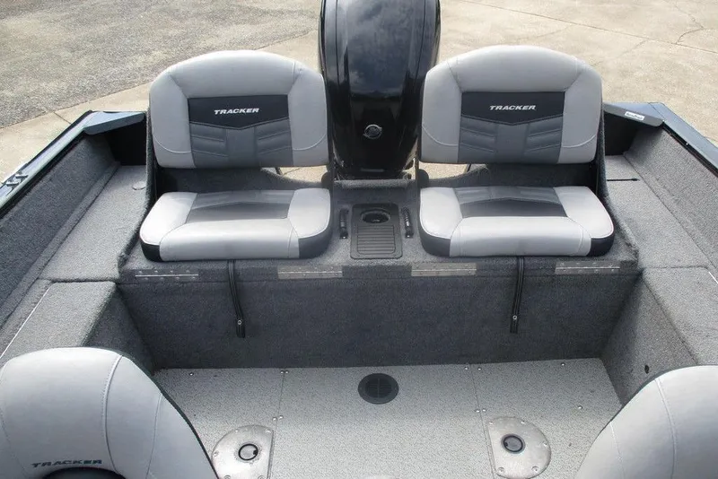 Slide: The Image of 2018 Tracker Pro Guide V-175 Combo boat interior with gray seating and motor. - 3