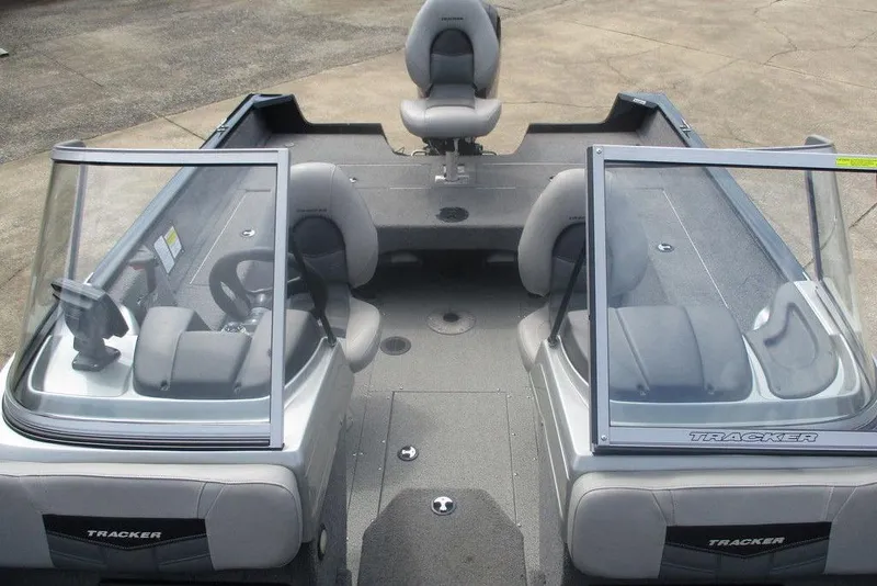Slide: The Image of 2018 Tracker Pro Guide V-175 Combo boat interior with dual consoles and seating. - 5