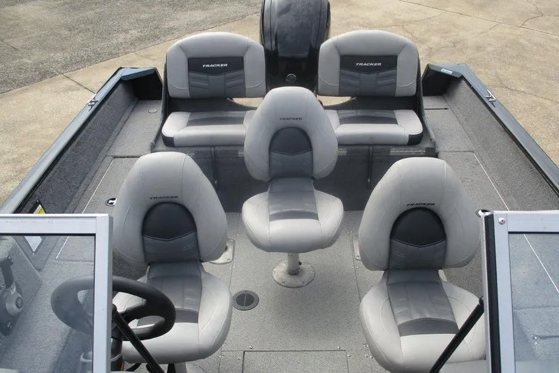 Slide: The Image of 2018 Tracker Pro Guide V-175 Combo boat interior with gray seating and steering wheel. - 9