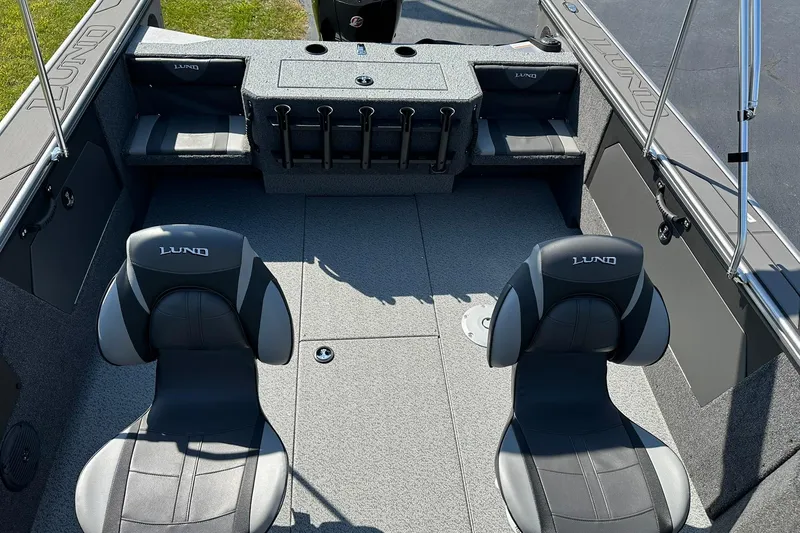 Slide: The Image of 2026 Lund 1875 Fisherman boat interior with seating and rod holders. - 14