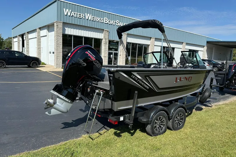 Slide: The Image of 2026 Lund 1875 Fisherman boat on trailer outside Water Werks dealership. - 3