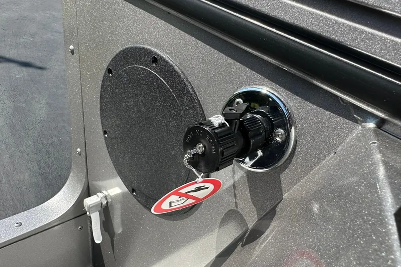 Slide: The Image of 2026 Lund 1875 Fisherman boat ignition with key and safety tag. - 37